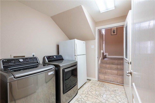 washroom featuring washing machine and dryer