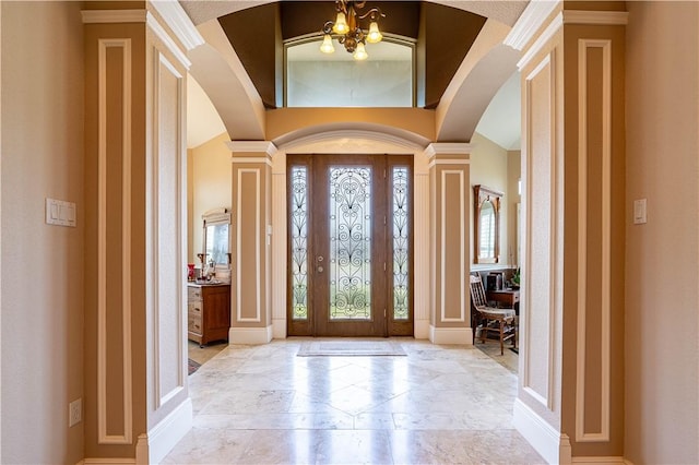 foyer with a chandelier