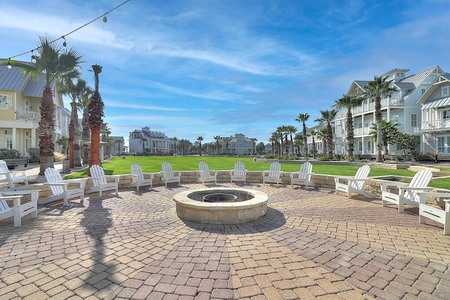 view of patio featuring a fire pit and a residential view