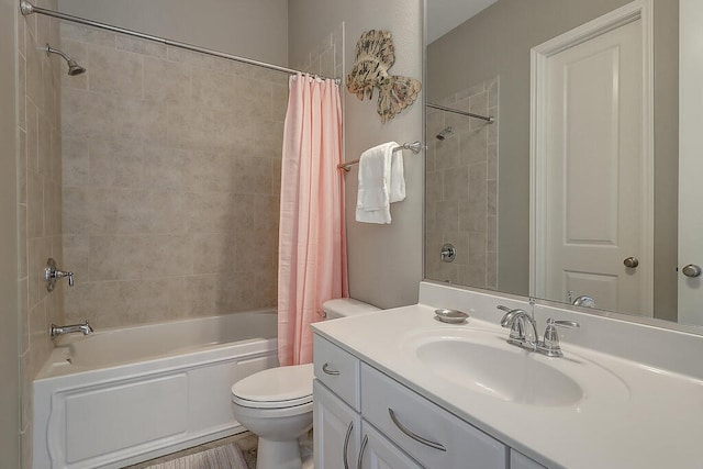 full bath with shower / bath combo with shower curtain, toilet, and vanity