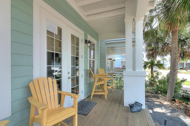 wooden terrace featuring a porch