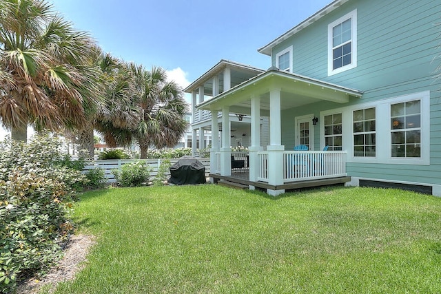 view of property exterior featuring a lawn and fence