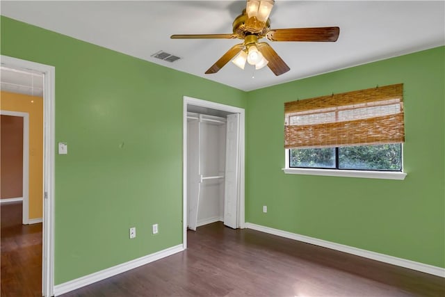 2826 Toronto Dr, Corpus Christi, TX 78414 - unfurnished bedroom featuring dark wood-style flooring, baseboards, a closet, and a ceiling fan