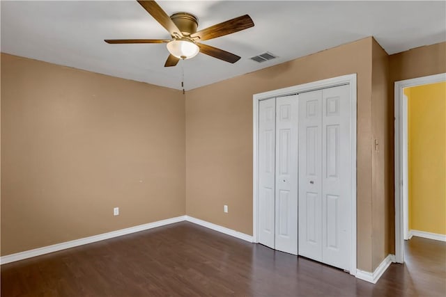 2826 Toronto Dr, Corpus Christi, TX 78414 - unfurnished bedroom featuring dark wood finished floors, a closet, baseboards, and a ceiling fan
