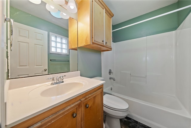 full bathroom featuring washtub / shower combination, vanity, toilet, and tile patterned flooring