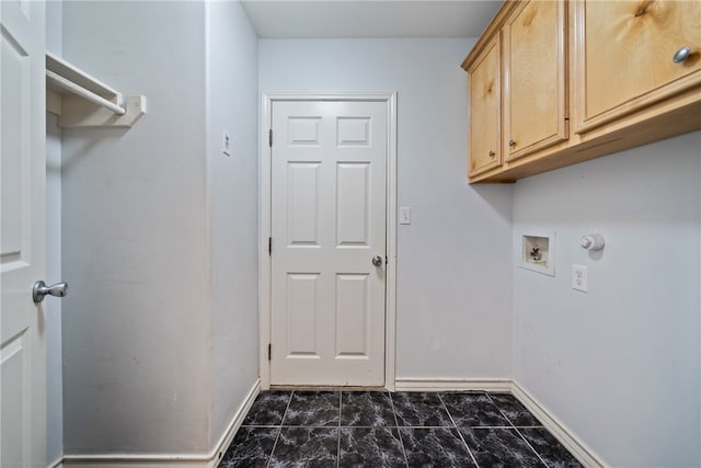 washroom featuring washer hookup and cabinets