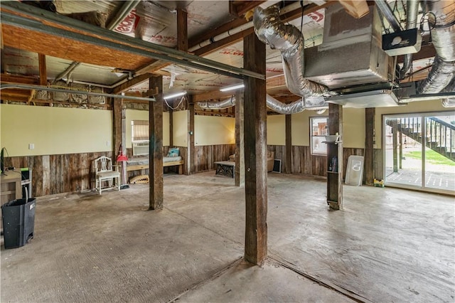 266 Lola Johnson Rd, Corpus Christi, TX 78418 - basement featuring a wainscoted wall, wood walls, and cooling unit