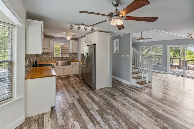266 Lola Johnson Rd, Corpus Christi, TX 78418 - kitchen featuring stainless steel refrigerator with ice dispenser, a sink, range with gas stovetop, and a ceiling fan