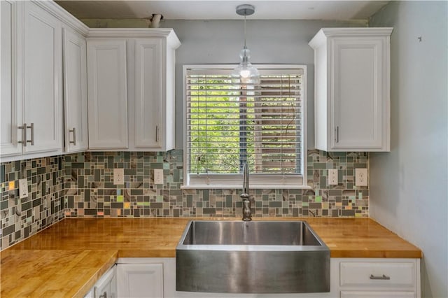 266 Lola Johnson Rd, Corpus Christi, TX 78418 - kitchen featuring wooden counters, a sink, and white cabinets