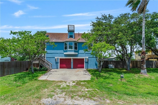 266 Lola Johnson Rd, Corpus Christi, TX 78418 - view of front of property featuring driveway, stairway, and an attached garage
