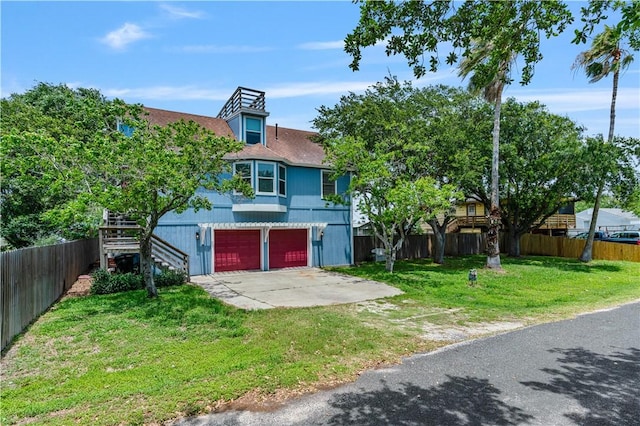 266 Lola Johnson Rd, Corpus Christi, TX 78418 - view of front of property with driveway, a garage, and stairway