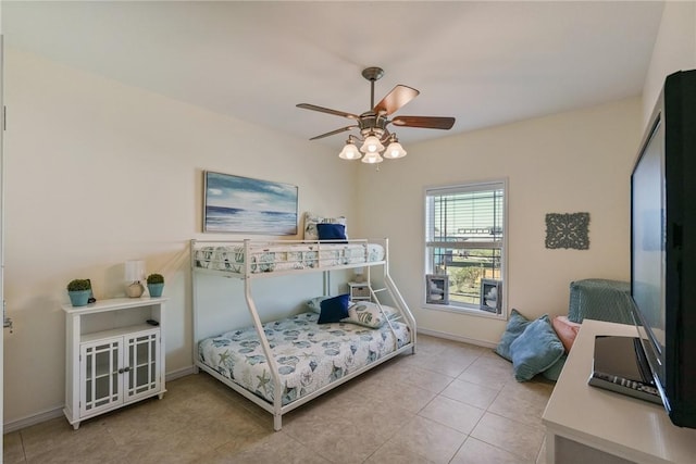 1035 Sea Secret St, Port Aransas, TX 78373 - bedroom featuring a ceiling fan, tile patterned floors, and baseboards