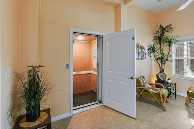 1035 Sea Secret St, Port Aransas, TX 78373 - doorway with light tile patterned floors and baseboards
