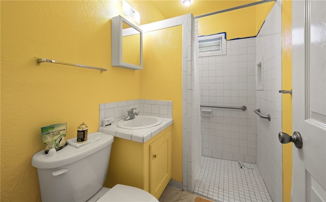 bathroom featuring vanity, a shower with shower curtain, and toilet