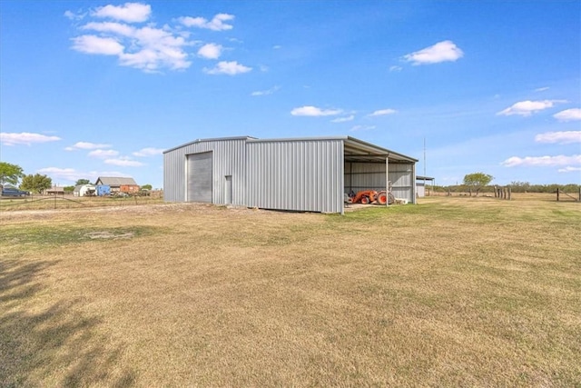 view of pole building with a lawn
