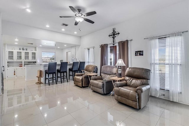 living room featuring visible vents, ceiling fan, and recessed lighting