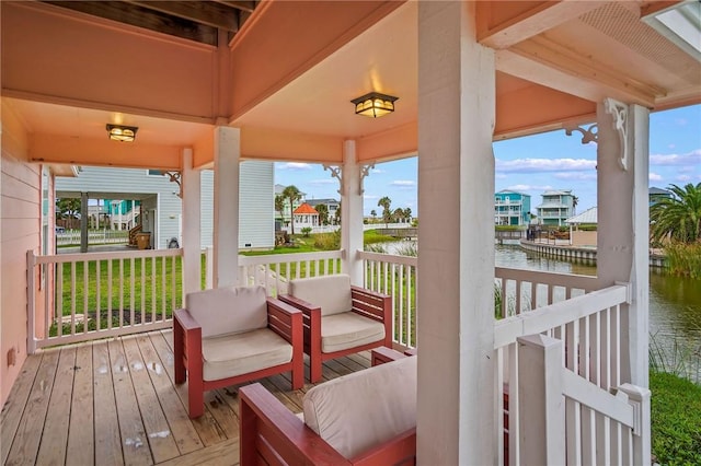 wooden deck with a water view