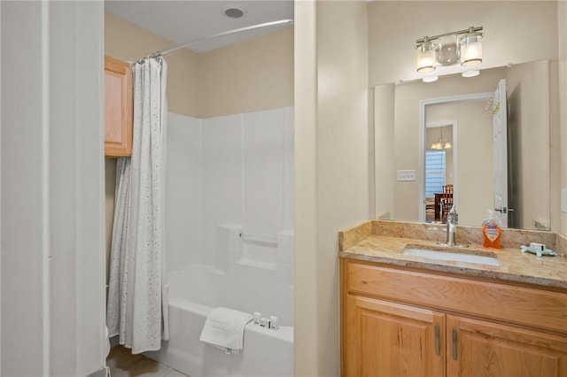 bathroom with vanity and shower / tub combo