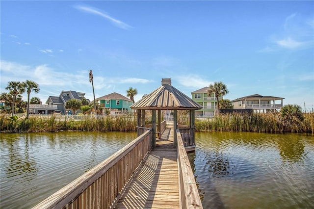 dock area with a water view and a gazebo