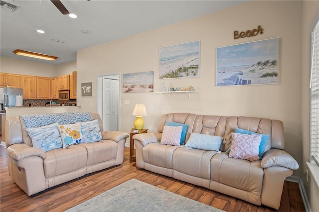 living room with light hardwood / wood-style flooring