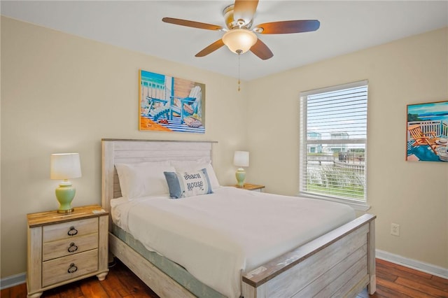 bedroom featuring ceiling fan and dark wood-type flooring