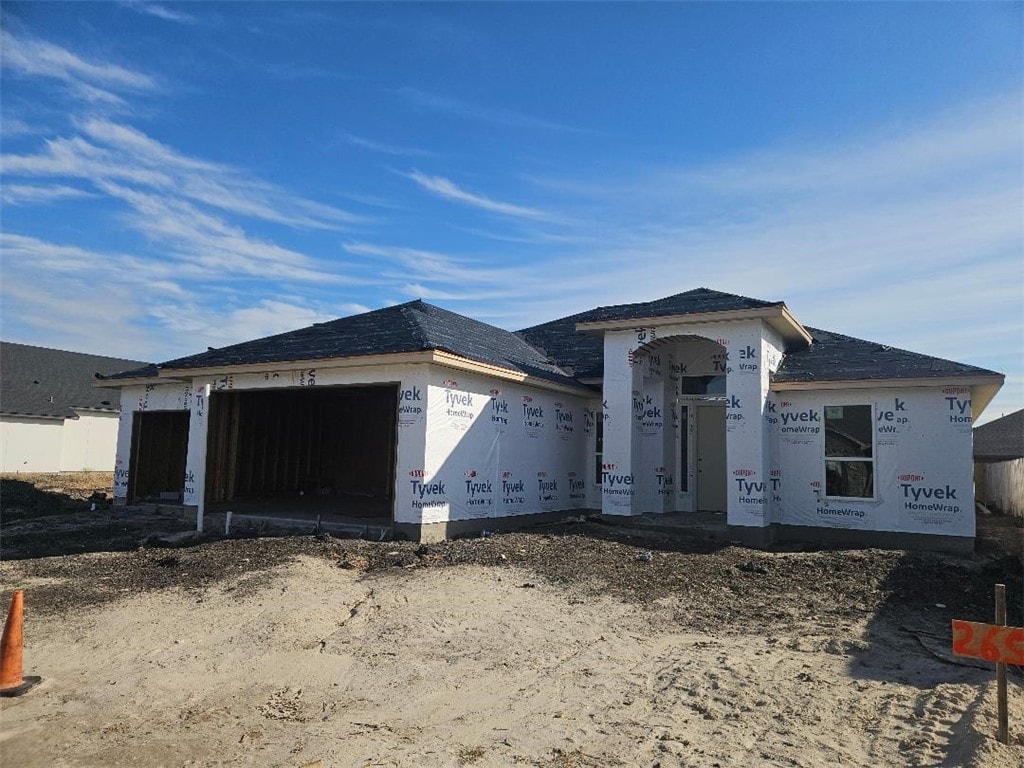 unfinished property with a garage