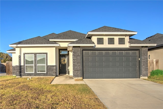 prairie-style house with a front lawn and a garage