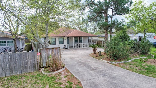 single story home featuring covered porch