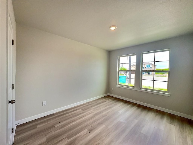 3405 Tanzanite Dr, Corpus Christi, TX 78414 - unfurnished room featuring wood finished floors and recessed lighting