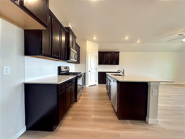 3405 Tanzanite Dr, Corpus Christi, TX 78414 - kitchen with stainless steel appliances, light wood-type flooring, light countertops, recessed lighting, and decorative backsplash