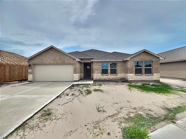 3405 Tanzanite Dr, Corpus Christi, TX 78414 - view of front of home with a garage, brick siding, concrete driveway, and a shingled roof