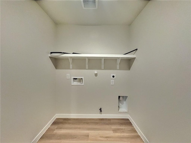 3405 Tanzanite Dr, Corpus Christi, TX 78414 - laundry area featuring hookup for a gas dryer, electric dryer hookup, washer hookup, and light wood-style floors