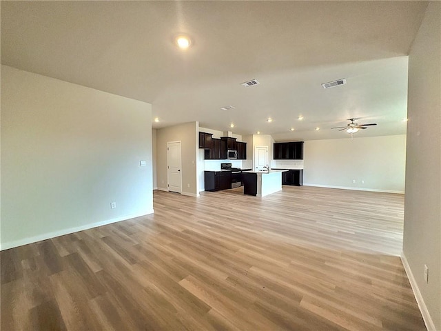 3405 Tanzanite Dr, Corpus Christi, TX 78414 - unfurnished living room featuring ceiling fan, light wood finished floors, and recessed lighting