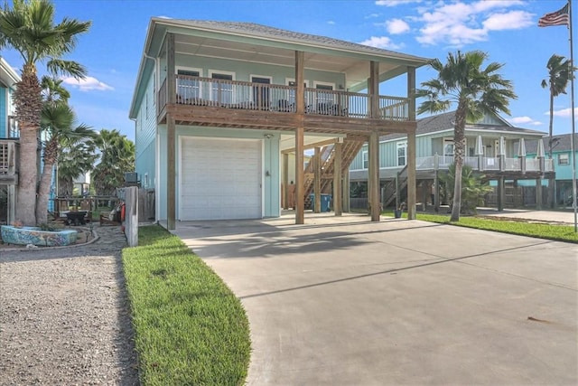 beach home featuring a garage and driveway