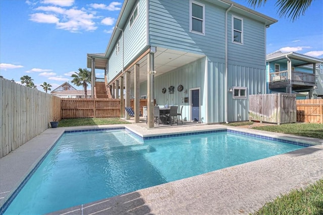 view of pool featuring a fenced in pool, outdoor dining area, a patio area, and a fenced backyard