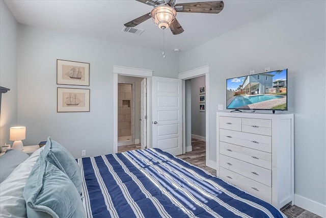 bedroom featuring baseboards, visible vents, connected bathroom, ceiling fan, and wood finished floors