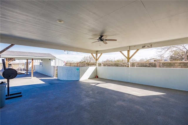 view of patio featuring fence and a ceiling fan