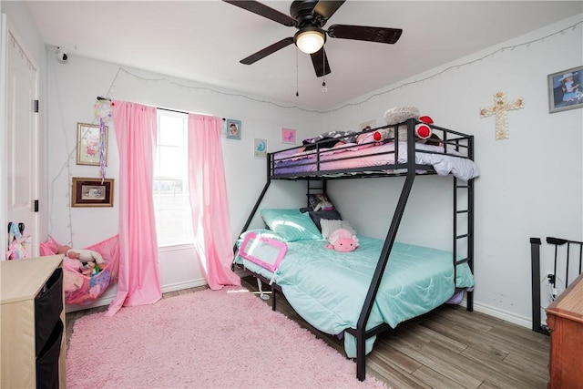 bedroom with wood-type flooring and ceiling fan