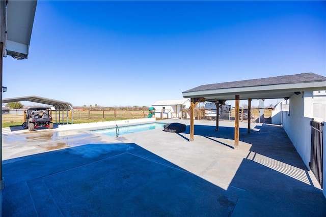 view of swimming pool featuring fence, a fenced in pool, and an outdoor structure