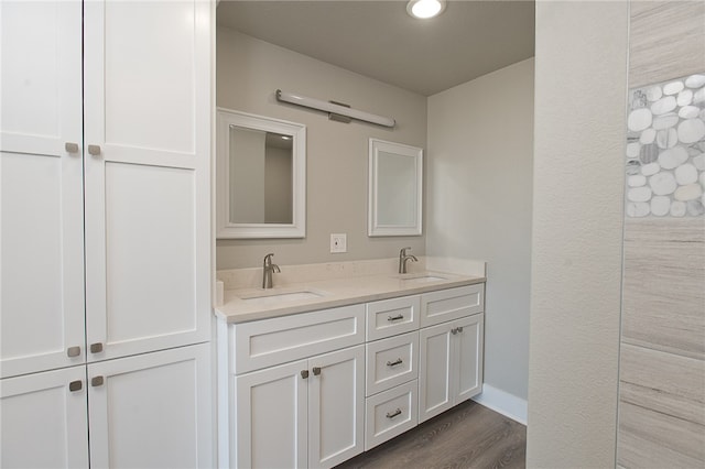 bathroom with hardwood / wood-style floors and vanity