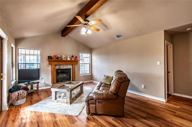 2725 Persimmon St, Corpus Christi, TX 78415 - living room featuring wood finished floors, ceiling fan, a tile fireplace, and baseboards