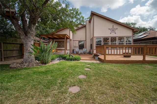 2725 Persimmon St, Corpus Christi, TX 78415 - back of house featuring a wooden deck and a sunroom