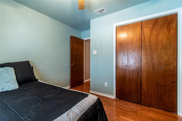2725 Persimmon St, Corpus Christi, TX 78415 - bedroom featuring wood finished floors, baseboards, and a closet