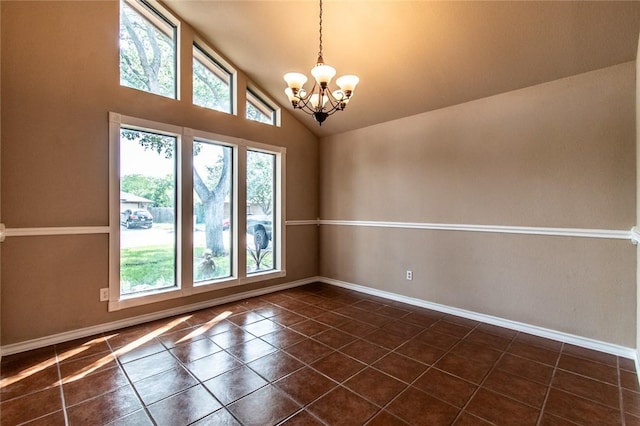 2725 Persimmon St, Corpus Christi, TX 78415 - unfurnished room featuring a chandelier, baseboards, dark tile patterned floors, and high vaulted ceiling