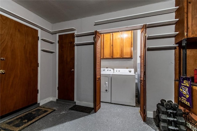 2725 Persimmon St, Corpus Christi, TX 78415 - laundry room featuring washer and clothes dryer, cabinet space, and baseboards