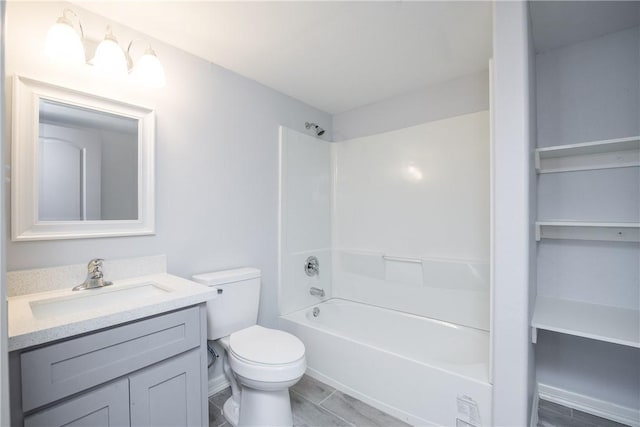 full bathroom with bathtub / shower combination, vanity, and toilet