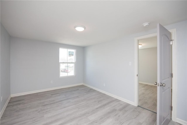 unfurnished room featuring light hardwood / wood-style floors