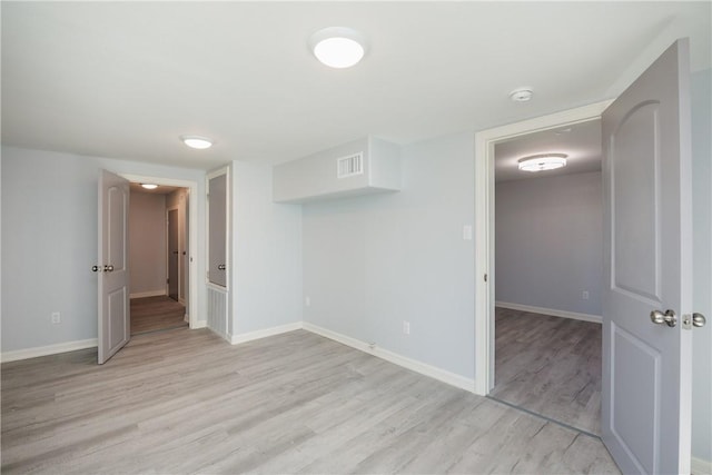 unfurnished room featuring light hardwood / wood-style floors