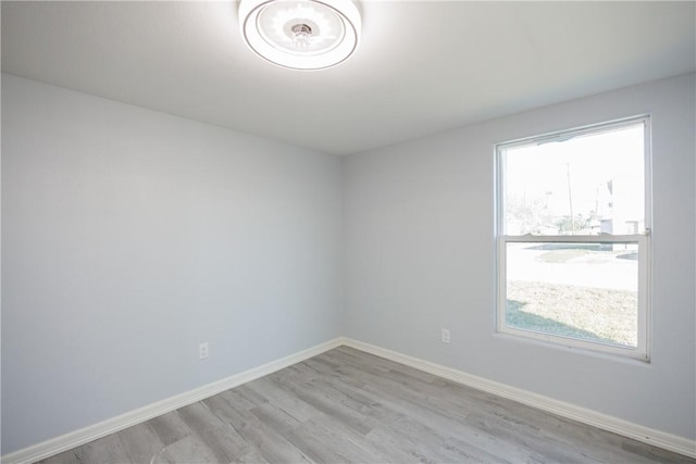 spare room featuring light wood-type flooring