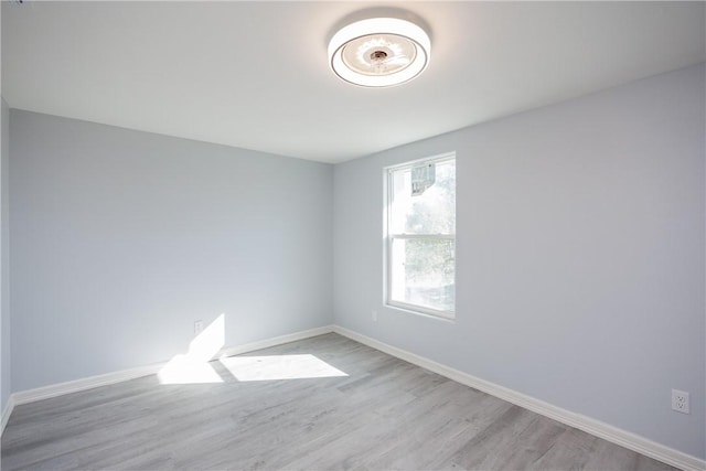 unfurnished room featuring light hardwood / wood-style floors